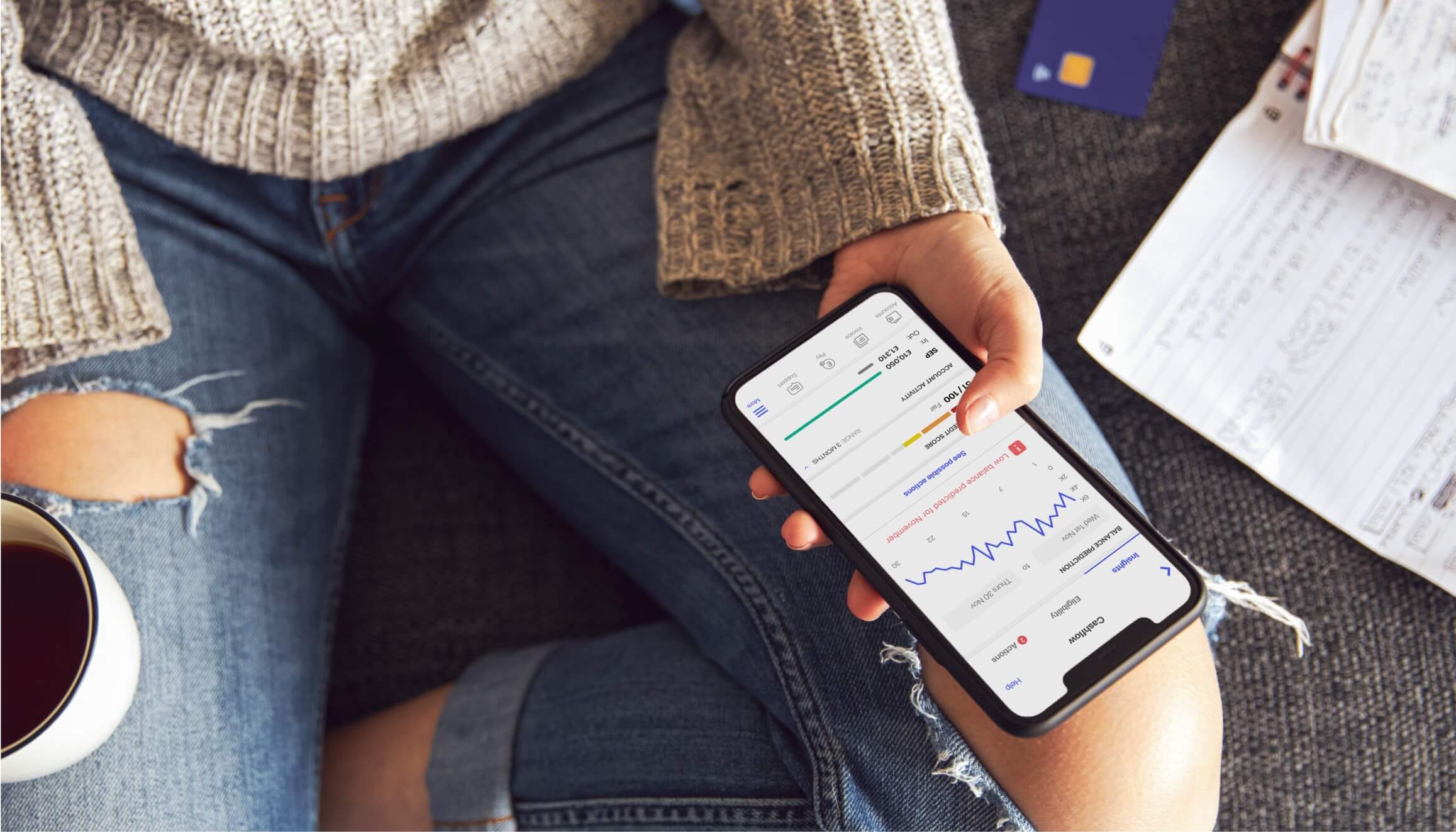 A hand holding a phone demonstrates the UI of the Tide Cash Flow Forecast product