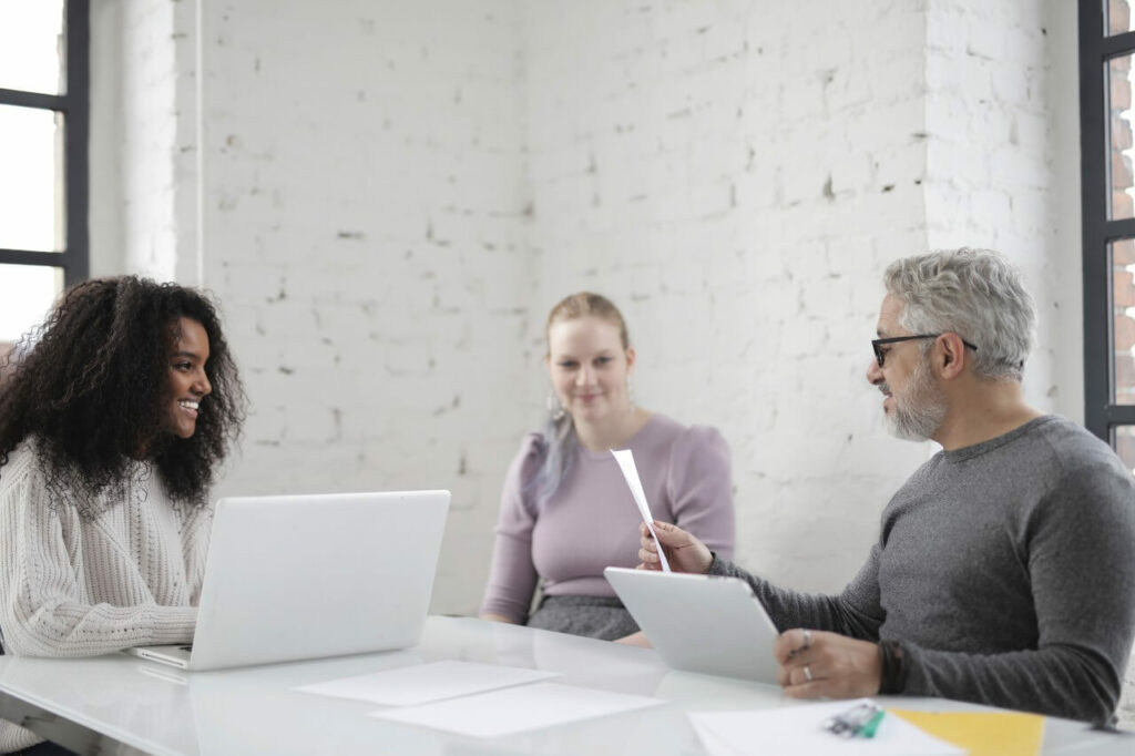 Three colleagues holding a meeting