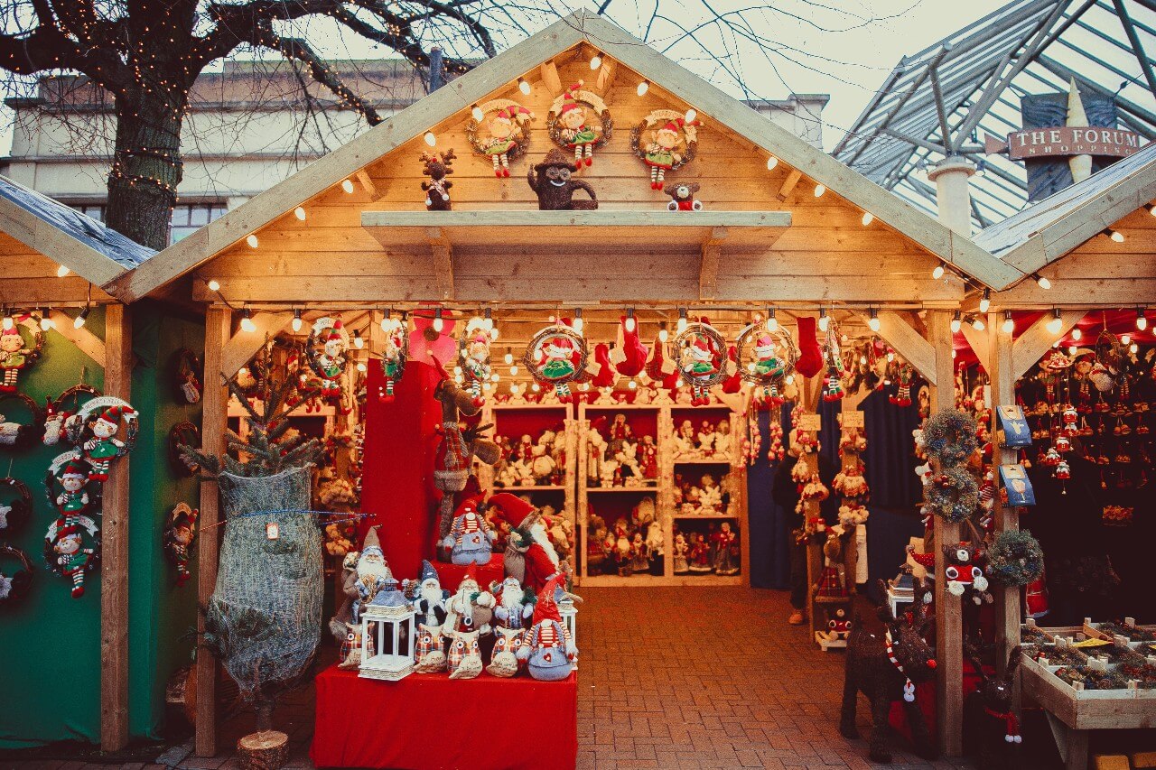 A stall at a Christmas market selling plush toys